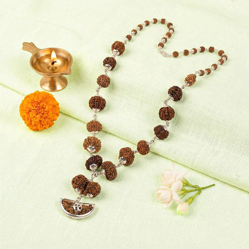 VASTUKOSHA 1-14 Mukhi Siddh Rudraksha Mala with authentic Nepali beads and 925 silver caps on a white fabric background.