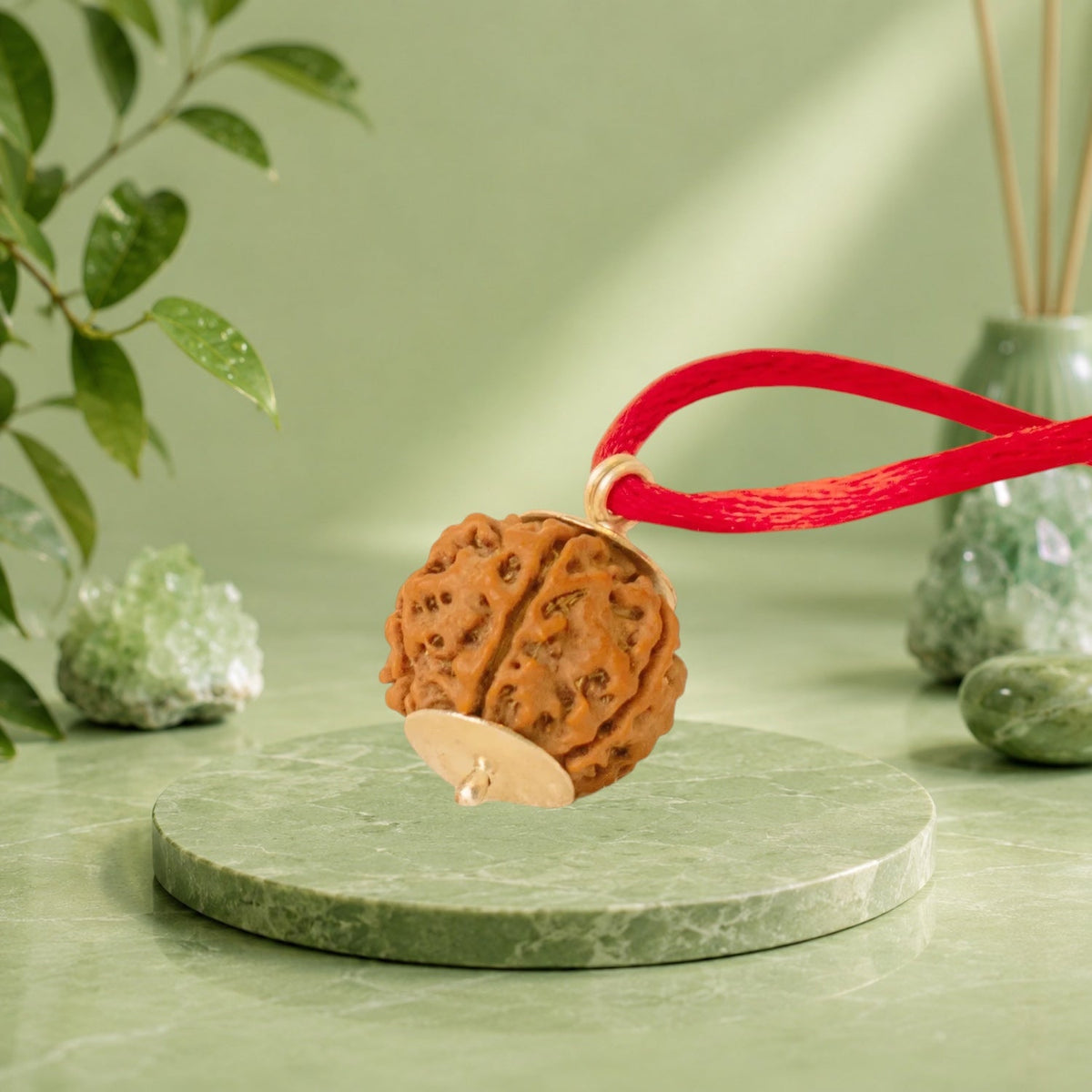 VASTUKOSHA 4 Mukhi Nepal origin Rudraksha bead pendant on a red cord, blessed and used for meditation.
