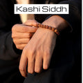 VASTUKOSHA 5 Mukhi Rudraksha bead bracelet worn on a wrist, representing divine blessings and spiritual protection.
