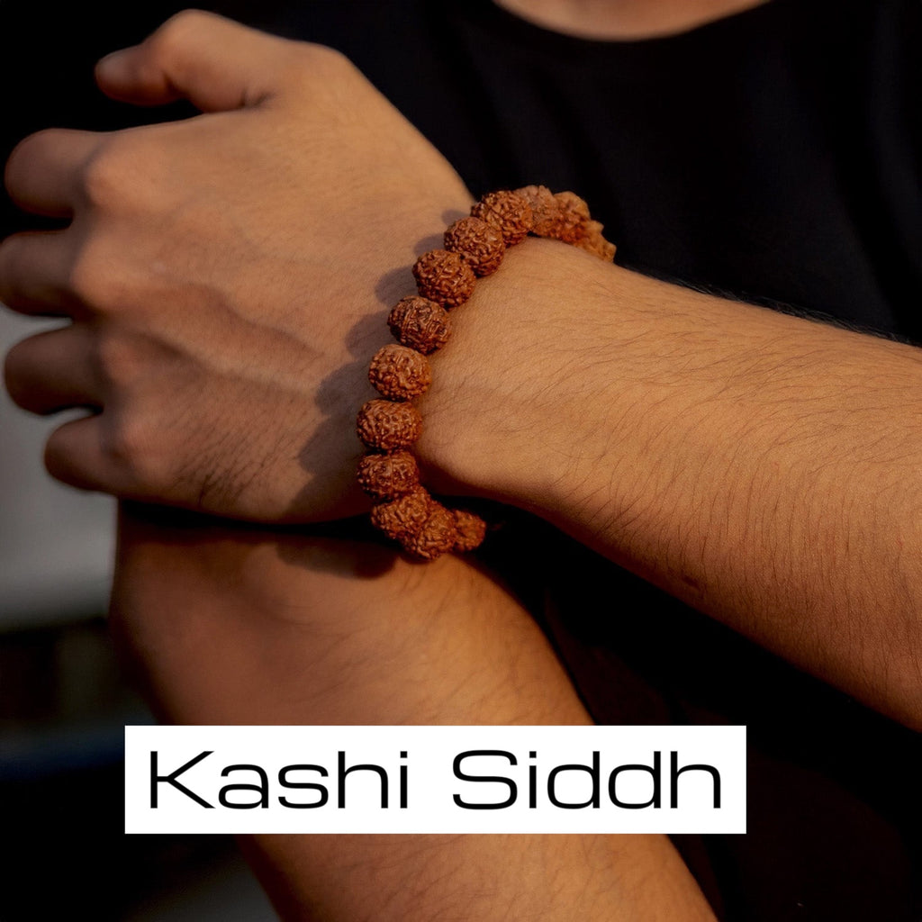 VASTUKOSHA 7 Mukhi Rudraksha bead bracelet worn on a wrist, representing divine blessings and spiritual protection.