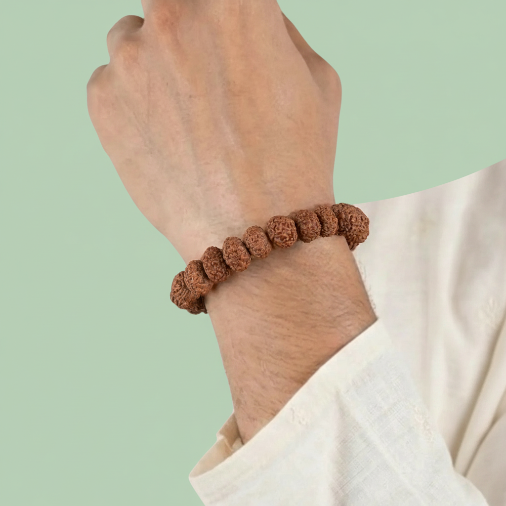 VASTUKOSHA 7 Mukhi Rudraksha bead bracelet worn on a wrist, featuring natural brown textured spiritual prayer beads.