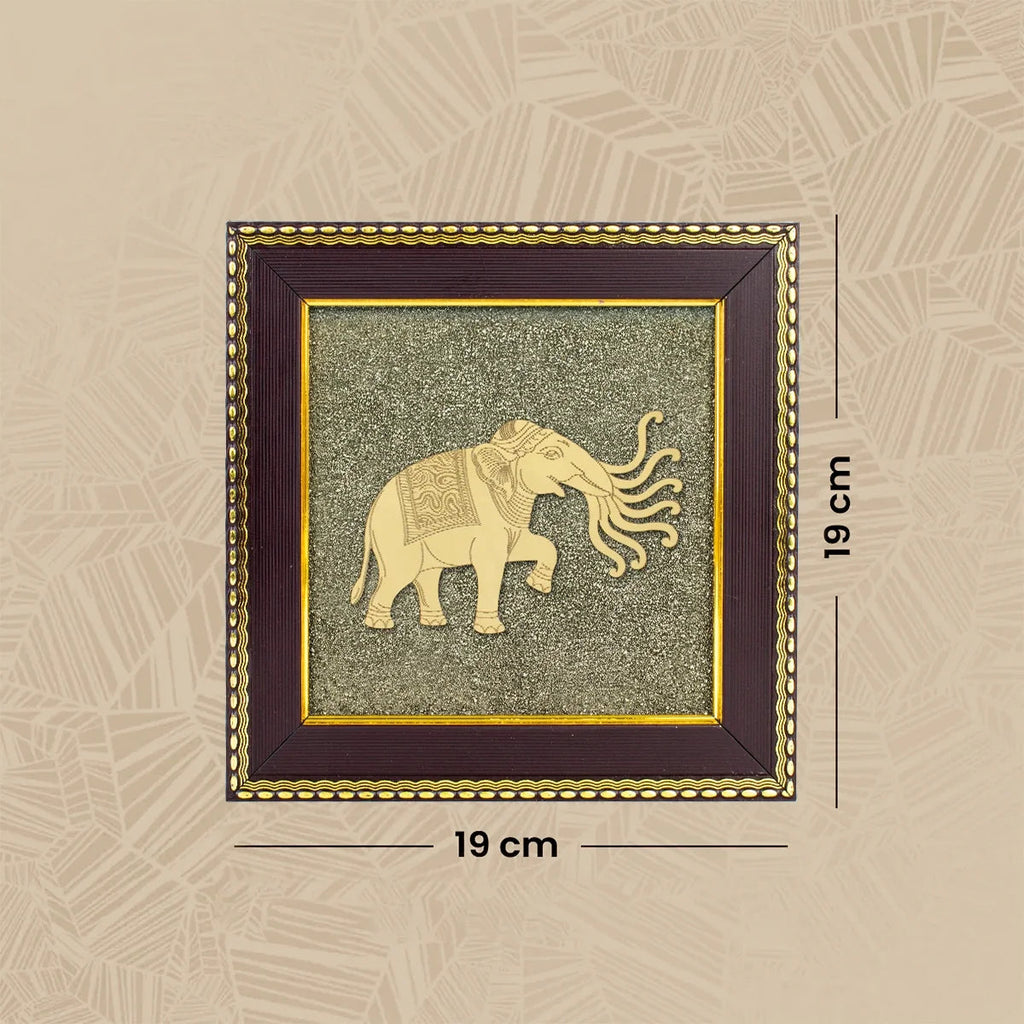 VASTUKOSHA 7 trunk Airavata elephant wall frame featuring gold-tone elephant motif on a textured raw pyrite background.