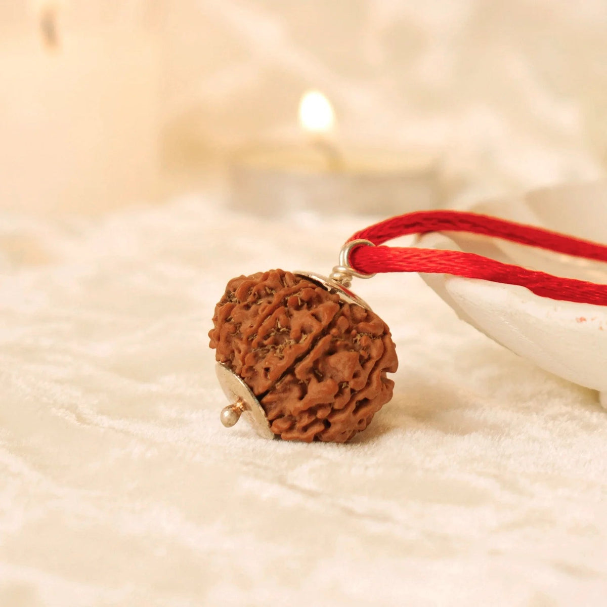 VASTUKOSHA 9 Mukhi Nepal Rudraksha bead with silver cap on a red thread for spiritual practice and meditation