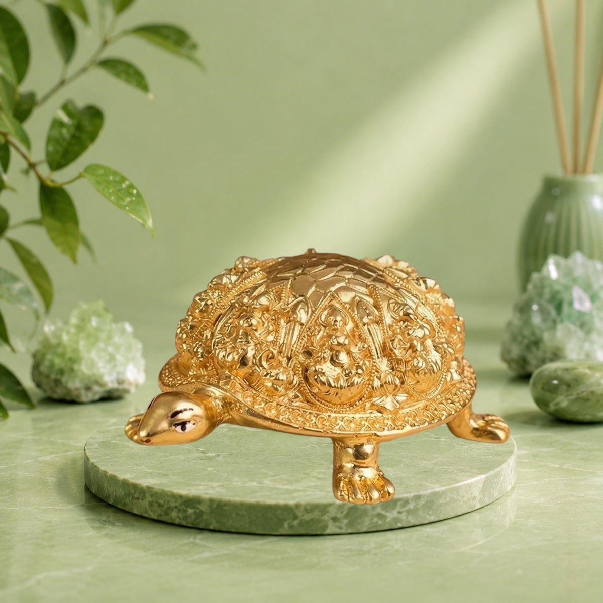 VASTUKOSHA Rinmukteshwar Siddh Ashtalakshmi tortoise idol in gold finish, placed on a cloth with flowers and diya.