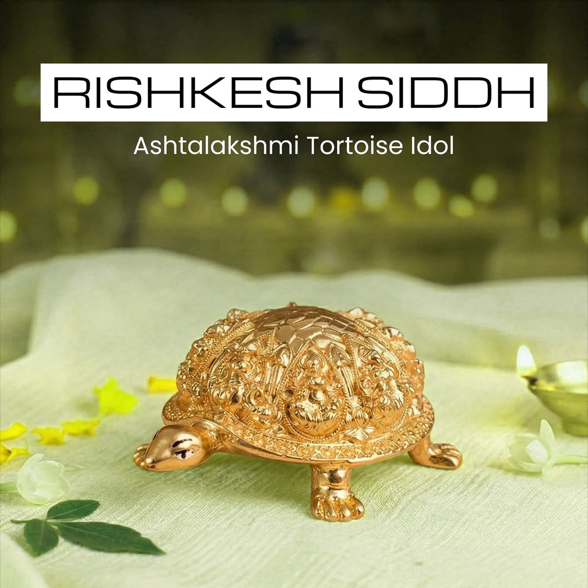 VASTUKOSHA gold-toned Ashtalakshmi tortoise idol for Vastu, featuring intricate carvings on a white cloth background.