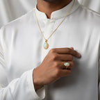 VASTUKOSHA Australian fire opal pendant and ring set in gold worn by a man in a white kurta for spiritual elegance.