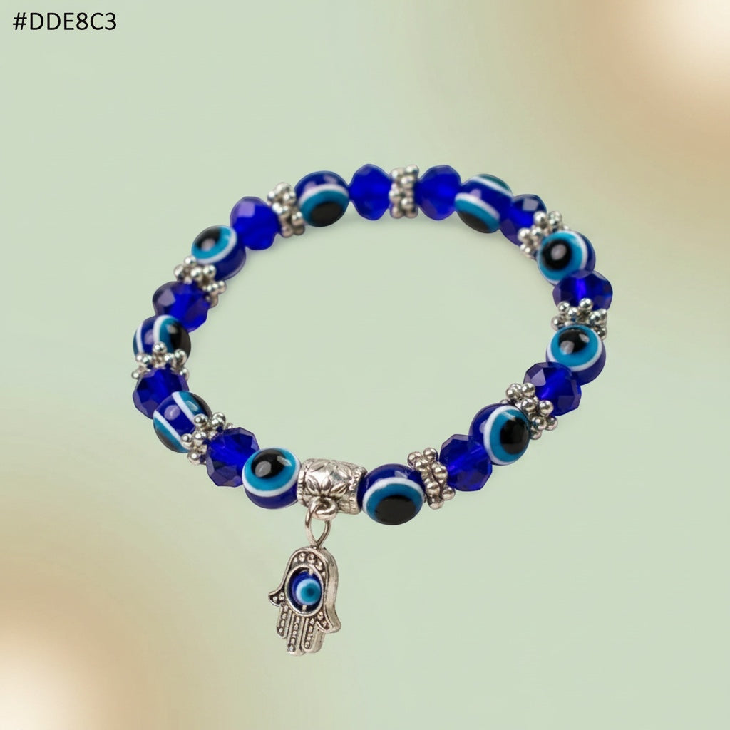VASTUKOSHA blue evil eye bead bracelet featuring a silver Hamsa hand charm for protective spiritual styling.