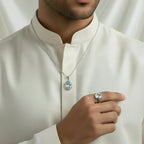 VASTUKOSHA natural blue topaz pendant and ring set worn by a man in a white kurta for spiritual and elegant style