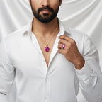 A man wearing a VASTUKOSHA Burmese ruby pendant and matching ring, styled with a crisp white shirt.