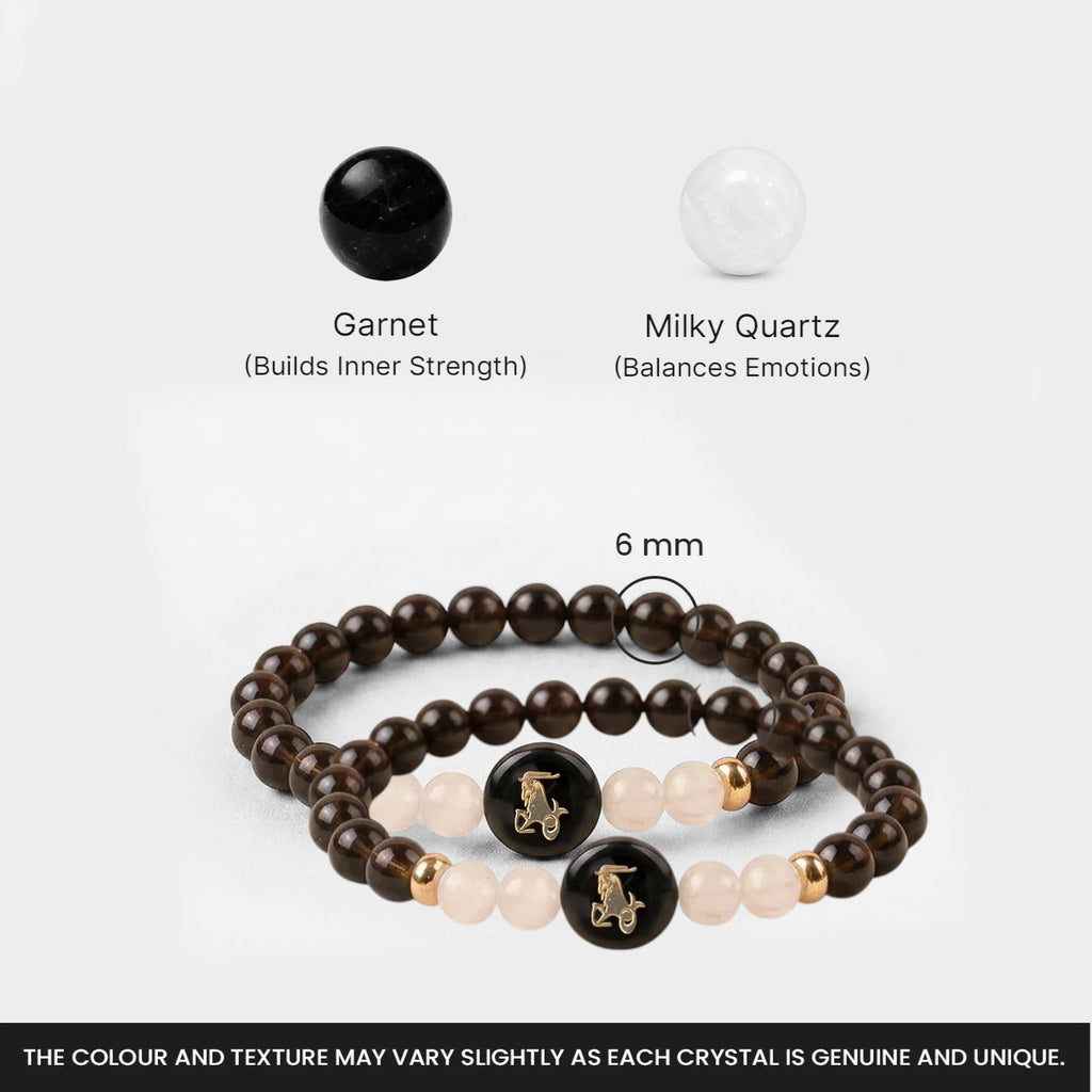 VASTUKOSHA Capricorn zodiac bracelet featuring dark garnet and milky quartz beads with a central goat symbol charm.