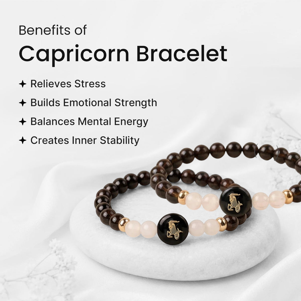 VASTUKOSHA Capricorn zodiac bracelet featuring dark garnet and milky quartz beads with a gold-accented charm