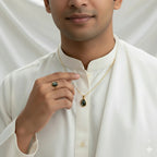 VASTUKOSHA natural cat's eye gemstone ring and pendant set worn by a man in a white kurta for spiritual practice