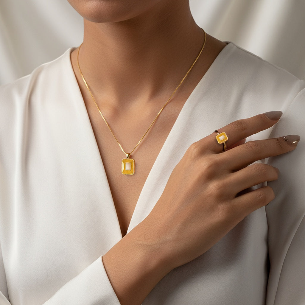 VASTUKOSHA Ceylon Pukhraj yellow sapphire pendant and matching ring set worn by a woman in a white blouse.
