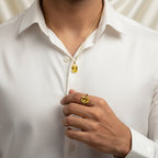 VASTUKOSHA Ceylon Pukhraj yellow sapphire gemstone set in a gold pendant and ring worn by a man in a white shirt.