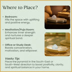 VASTUKOSHA clear quartz tumble stone displayed on a decorative hand-shaped tray for meditation and home decor
