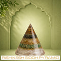 VASTUKOSHA Rinmukteshwar Siddh conical crystal pyramid with a selenite base for wealth and financial energy flow.
