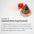 VASTUKOSHA Rishikesh Siddh Conical Dhan Yog Pyramid with crystal layers and a selenite base, next to marigold flowers.