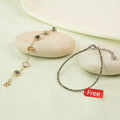 VASTUKOSHA multi-crystal bracelet with gold-tone chain and raw pyrite anklet on smooth stones for prosperity.