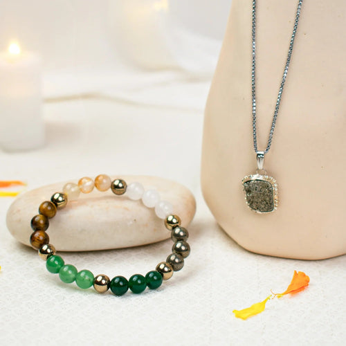 VASTUKOSHA Dhan Yog crystal bracelet with multi-coloured beads and a matching pendant necklace on a white surface.