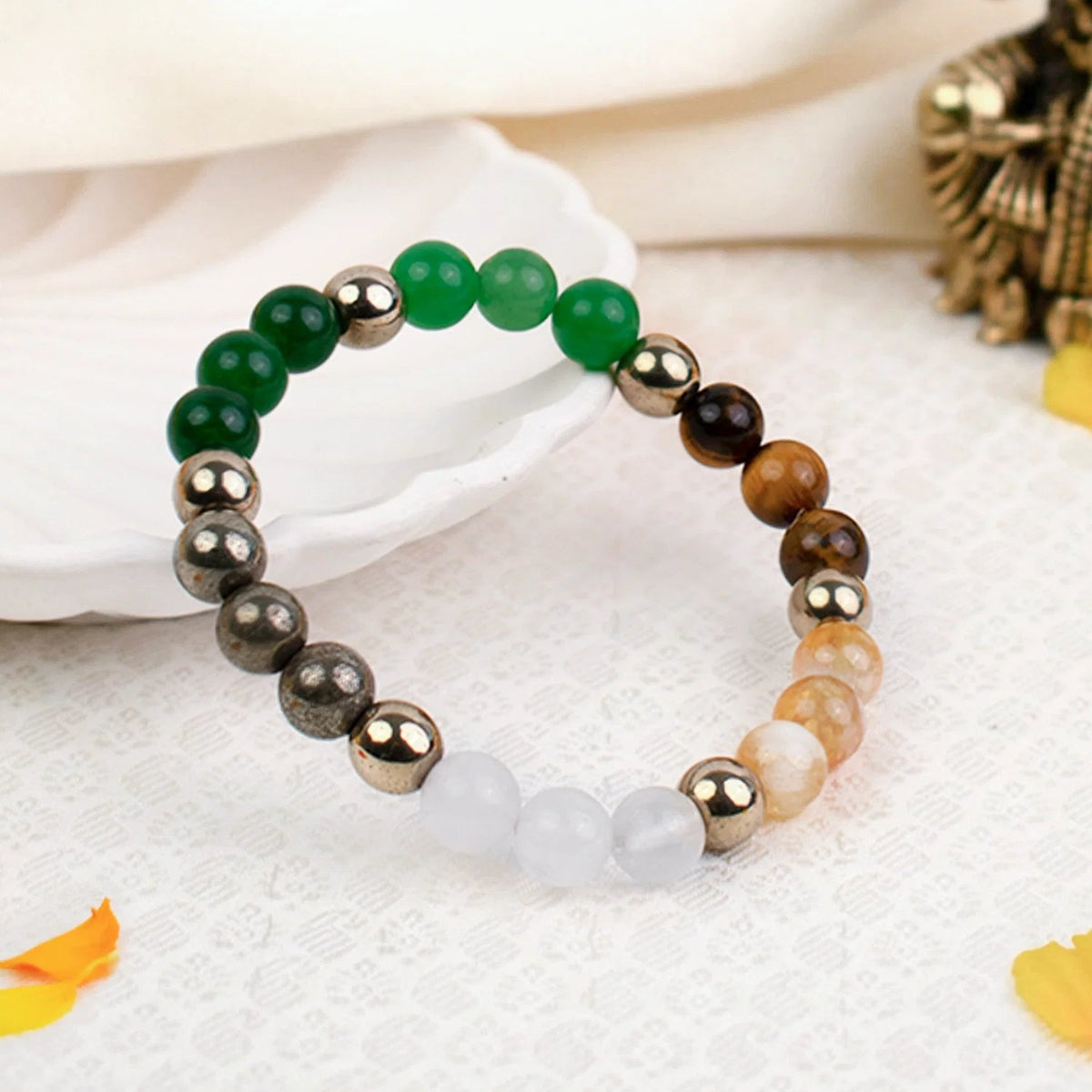 VASTUKOSHA Dhan Yog multi-crystal bracelet featuring green aventurine, tiger eye, citrine, quartz, pyrite, and hematite.