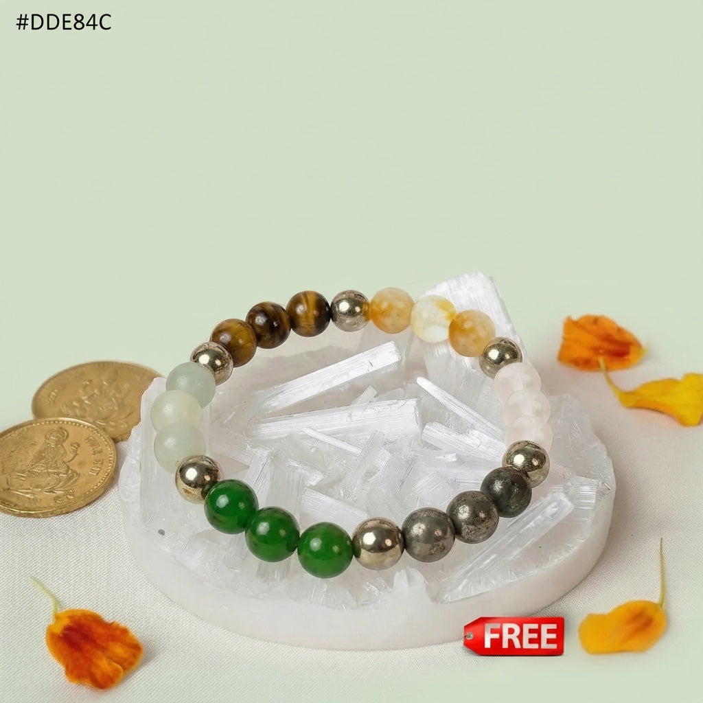 VASTUKOSHA Dhan Yog multi-crystal bracelet featuring Tiger Eye, Pyrite, and Green Aventurine on a raw Selenite plate.