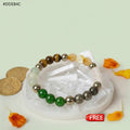 VASTUKOSHA Dhan Yog multi-crystal bracelet featuring Tiger Eye, Pyrite, and Green Aventurine on a raw Selenite plate.