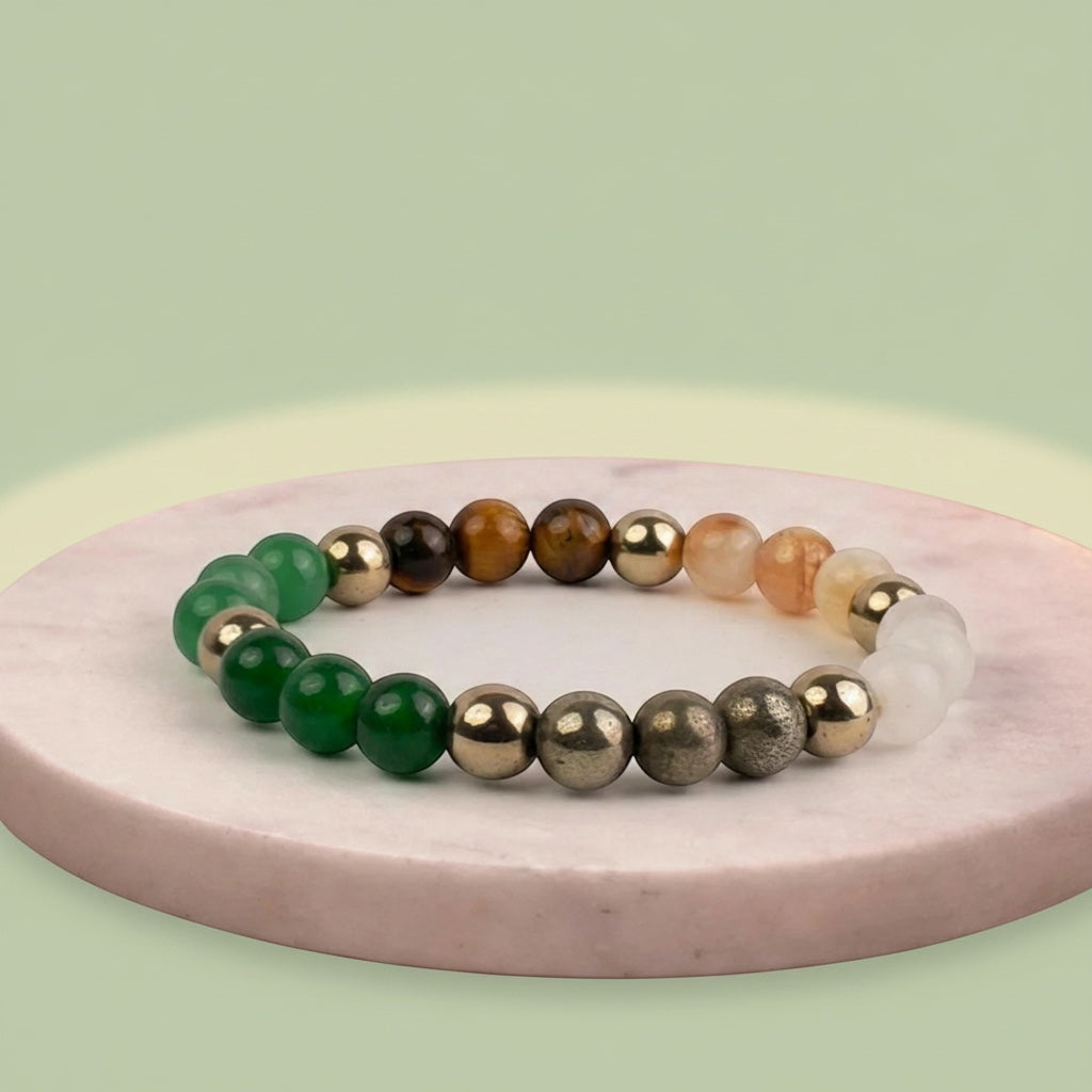 VASTUKOSHA Dhan Yog crystal bracelet featuring Tiger Eye, Pyrite, Citrine, Quartz, Green Aventurine, and Hematite beads.