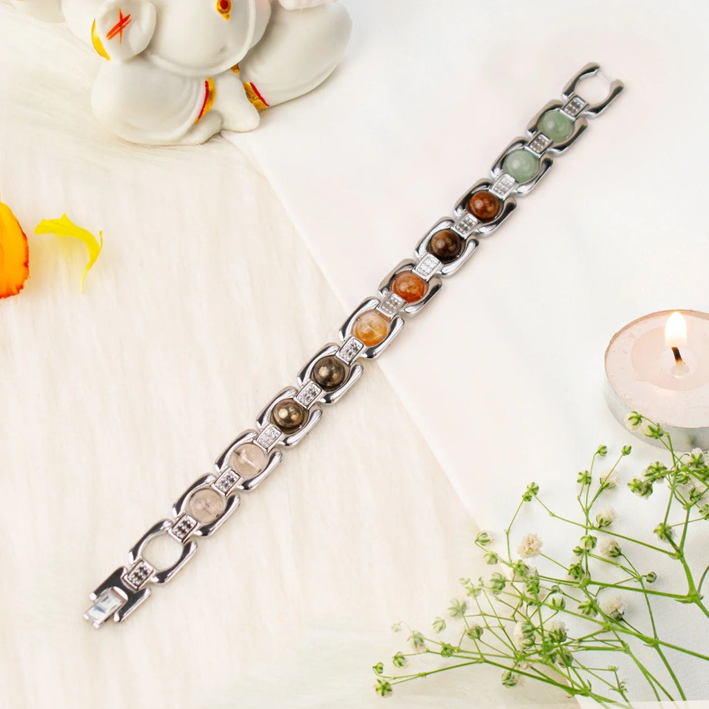 VASTUKOSHA Metal Dhan Yog bracelet featuring silver-plated links with Tiger Eye, Pyrite, Citrine, Quartz, and Aventurine.