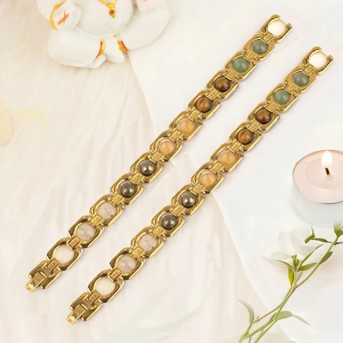 VASTUKOSHA Dhan Yog bracelet set featuring gold-plated metal links with genuine pyrite, tiger eye, and quartz crystals.