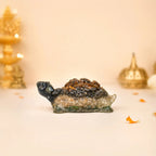VASTUKOSHA Collector's Edition Dhan Yog tortoise figurine crafted from Tiger Eye, Pyrite, Citrine, and Green Aventurine.