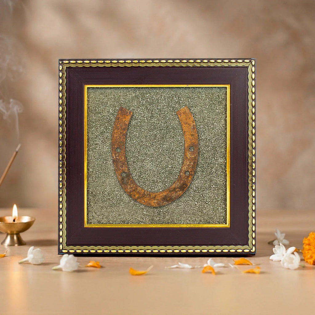 VASTUKOSHA Ghode Ki Naal horseshoe mounted on a sparkling raw pyrite frame, displayed as Vastu-inspired home decor.