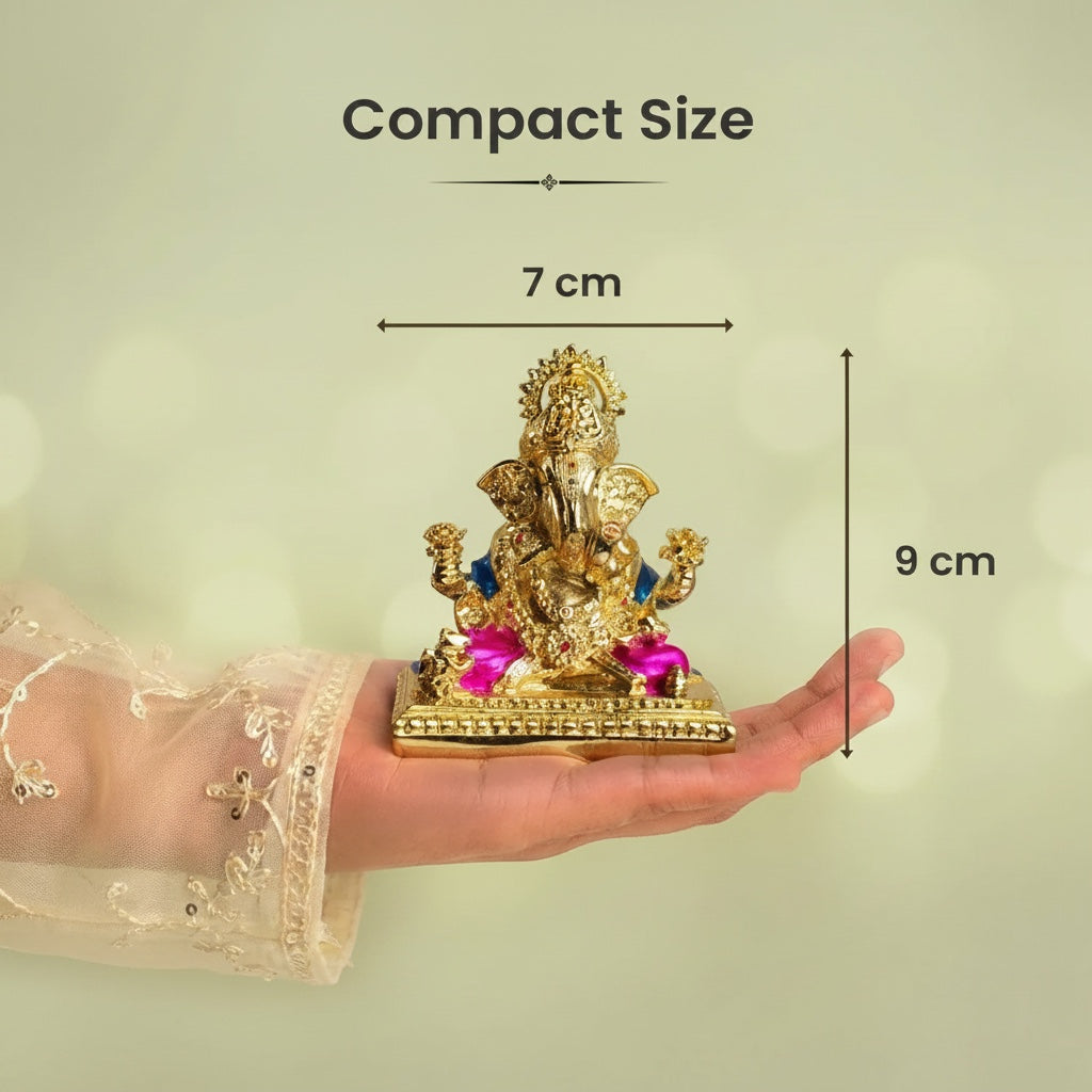 VASTUKOSHA golden-plated Shri Siddhivinayak Ganesha idol held in a hand, showing compact 7cm by 9cm size.