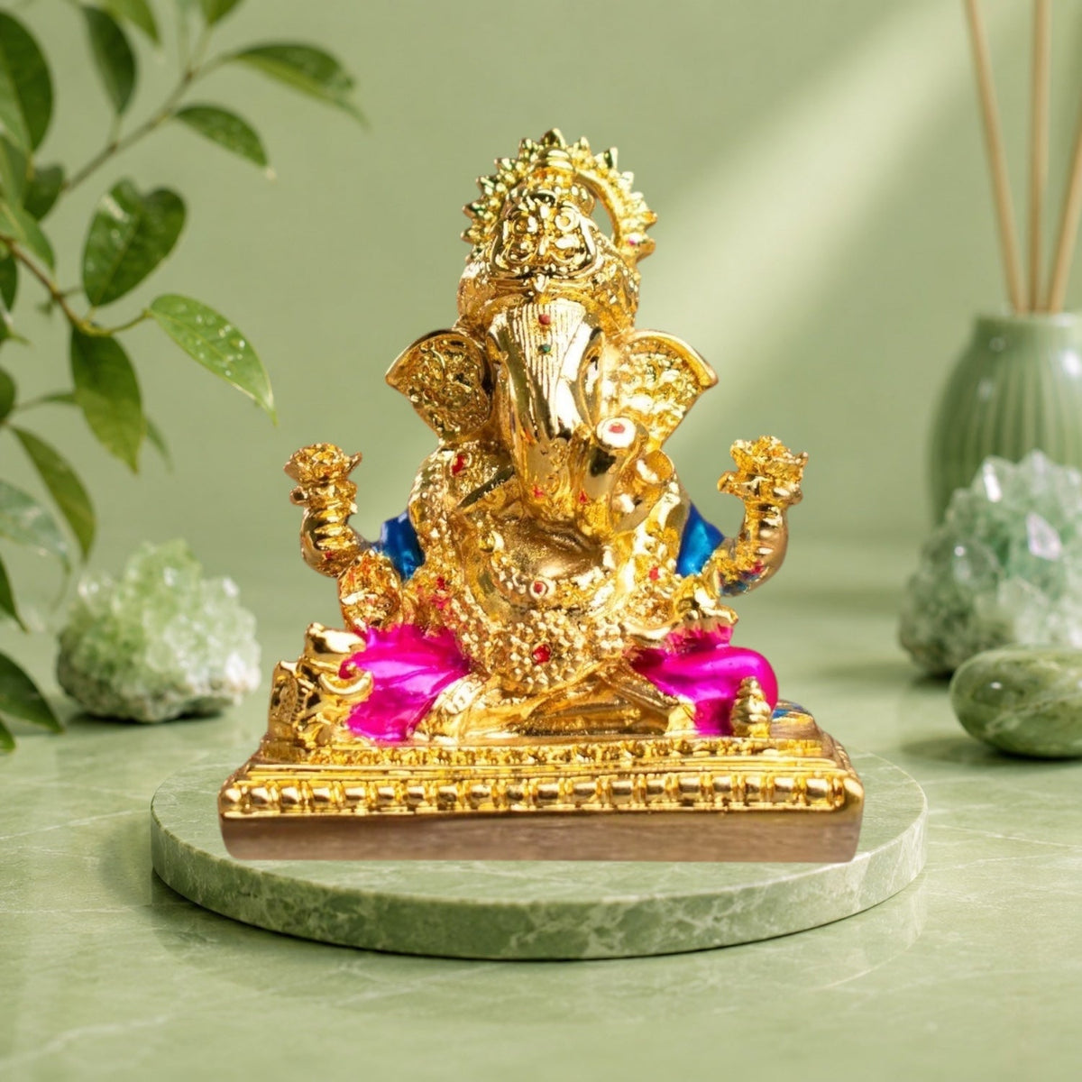 VASTUKOSHA golden-plated Shri Siddhivinayak Ganesha idol with pink and blue accents on a decorative base