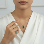 VASTUKOSHA natural green chalcedony oval pendant necklace and matching ring worn by a woman in a white top