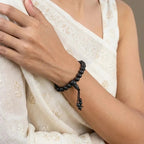 VASTUKOSHA Karungali black ebony wood bead bracelet worn on a woman's wrist for spiritual practice and daily wear