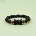 VASTUKOSHA Karungali black ebony wood bead bracelet with two 5 Mukhi Rudraksha beads and a central wooden Damru charm.