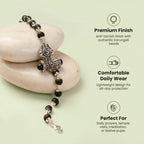 VASTUKOSHA Om Trinetra Trishul Damru Karungali ebony wood bead bracelet with silver-toned Shiva symbols on smooth stones.