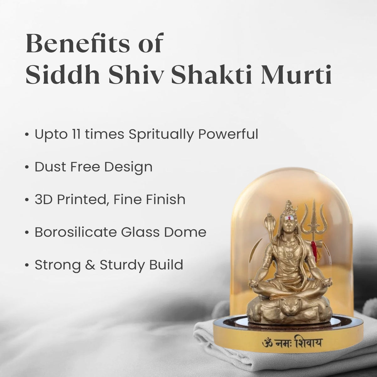 VASTUKOSHA Haridwar Siddh Shiv Shakti Murti in a protective borosilicate glass dome on a soft fabric background.