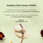VASTUKOSHA Mahadev Trishul Damru Rudraksha bracelet with oxidised silver finish resting on smooth stones