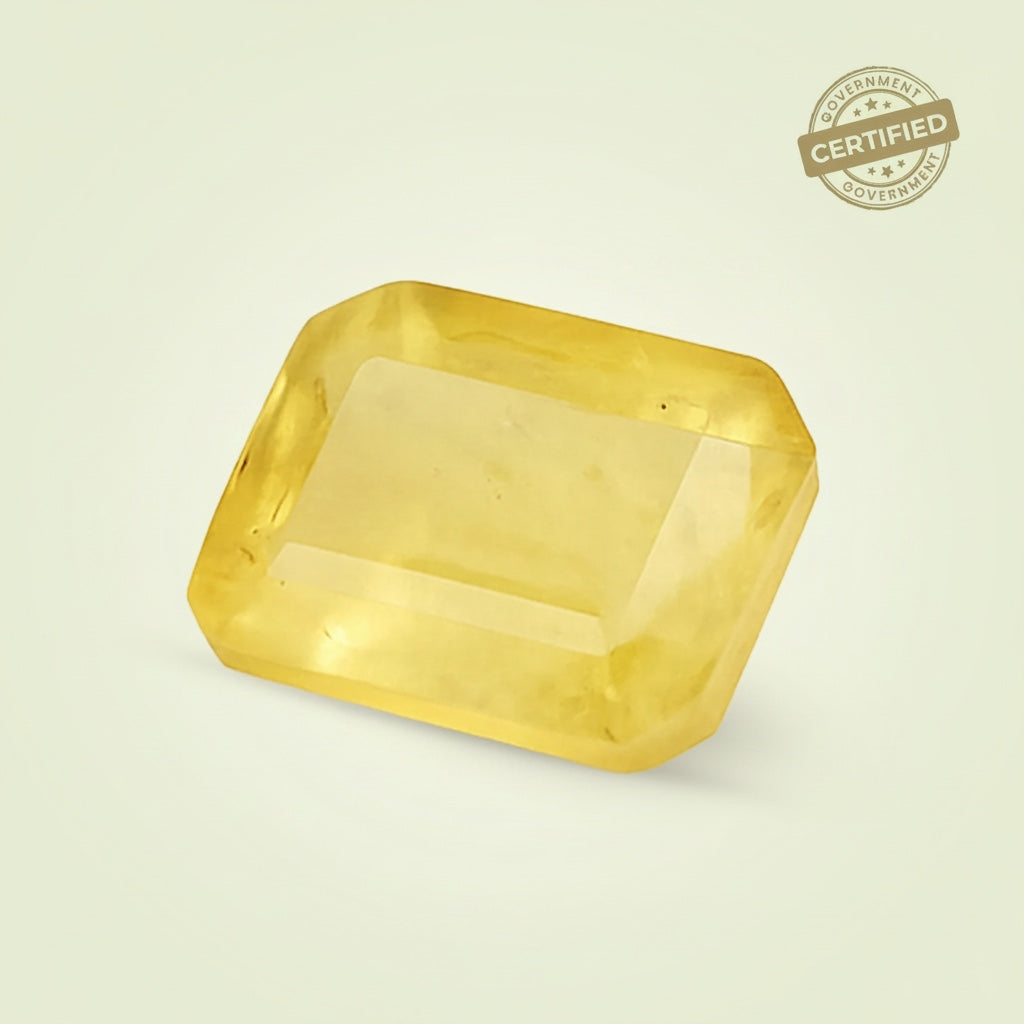 VASTUKOSHA natural Ceylon Pukhraj yellow sapphire gemstone with a faceted rectangular cut and certified quality.