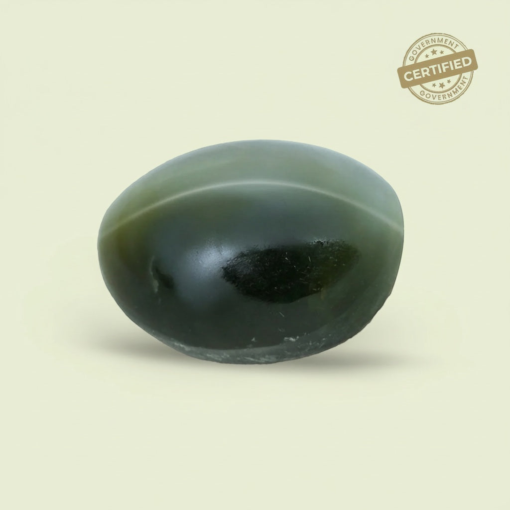 VASTUKOSHA natural green cat's eye gemstone with chatoyancy effect, certified for spiritual and astrological practice.