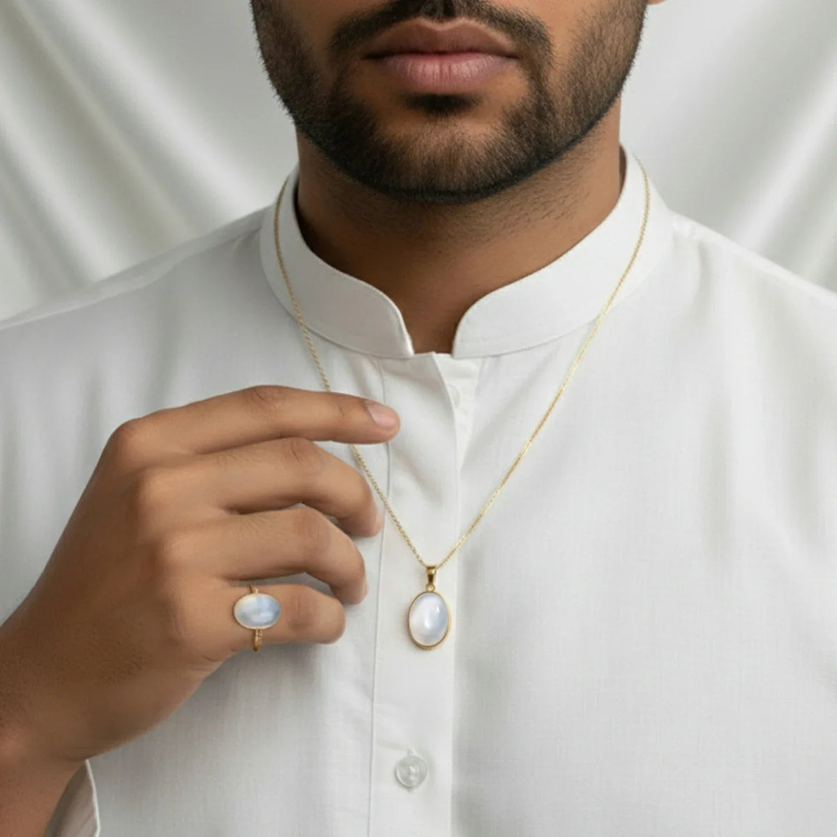 VASTUKOSHA natural moonstone pendant and ring set worn by a man in a white kurta for spiritual practice