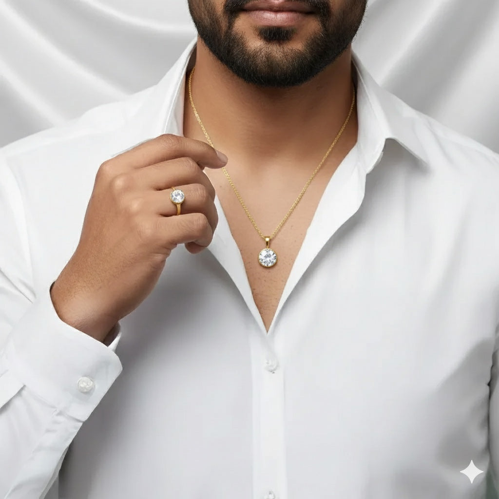 Man wearing a VASTUKOSHA natural zircon gold ring and matching pendant against a white shirt background