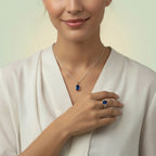 VASTUKOSHA natural blue Neelam gemstone pendant and matching ring worn by a woman in a white blouse