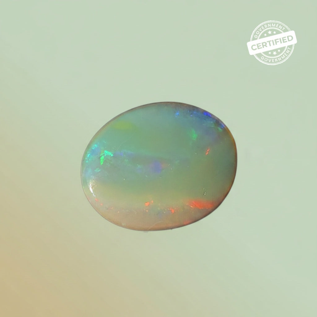 VASTUKOSHA oval fire opal gemstone with iridescent play of colour and government certified seal