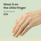 VASTUKOSHA pearl ring worn on the little finger, featuring a smooth white gemstone set in a polished silver band.