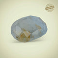 VASTUKOSHA Peetambari Neelam gemstone with a pale blue and golden-yellow hue, featuring a faceted cut.