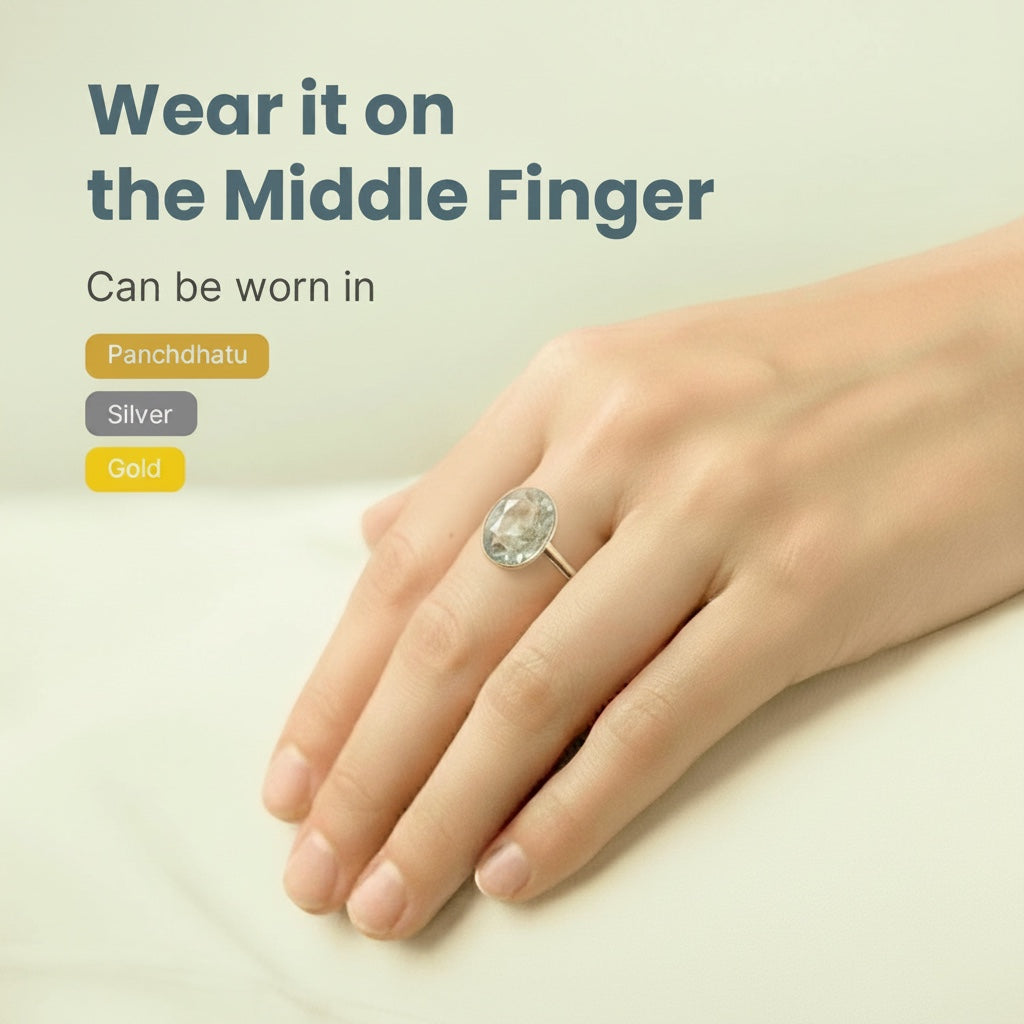 VASTUKOSHA Peetambari Neelam gemstone ring worn on a finger, showcasing a golden-yellow oval stone in a metal setting.