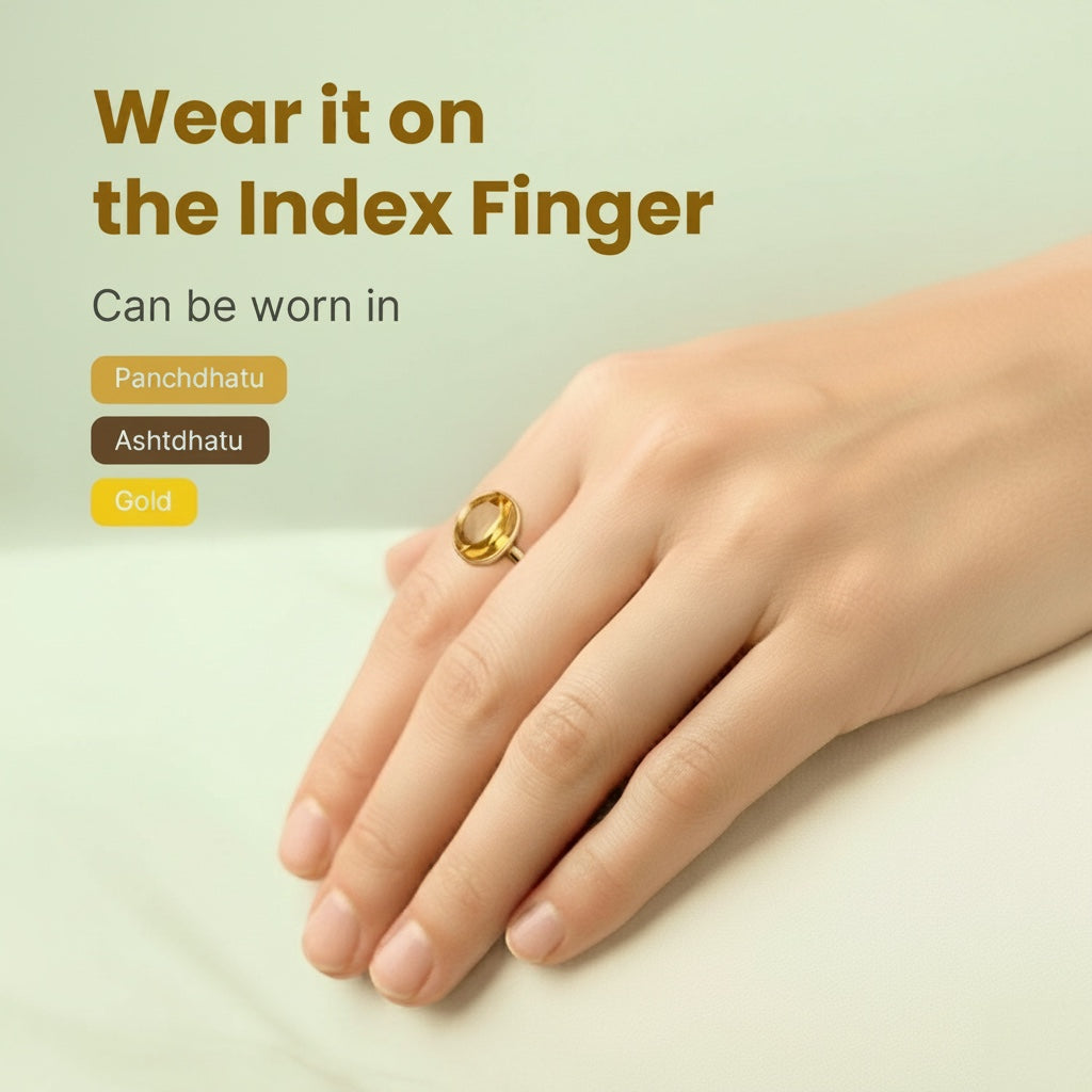 VASTUKOSHA Pukhraj gemstone ring worn on the index finger, showcasing a yellow natural stone in a minimalist setting.
