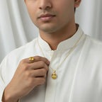 VASTUKOSHA Pukhraj yellow sapphire gemstone ring and pendant set worn by a man in a white traditional kurta